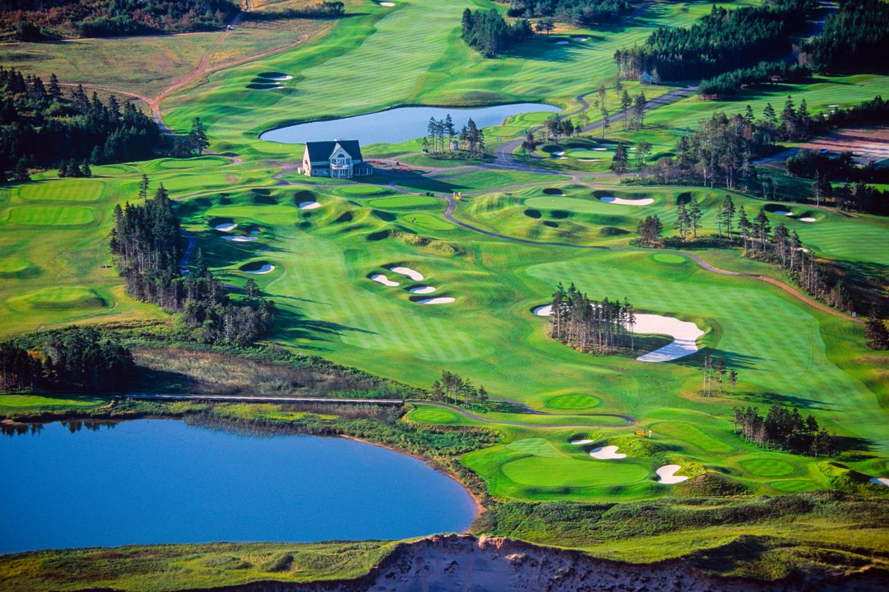 Aerial view of a golf course with fairways, bunkers and ponds