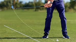 Close-up of a golfer and club during the downswing