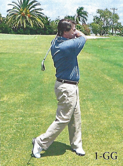 Golfer demonstrating the finish with the club above the shoulder