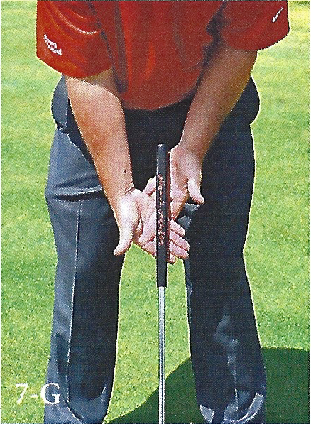 Close-up showing hand placement on a putter grip