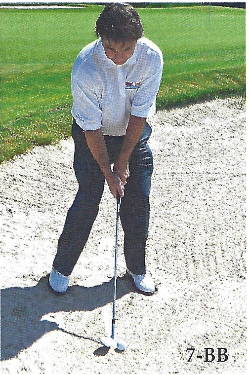 Front view of a golfer setting up for a greenside bunker shot